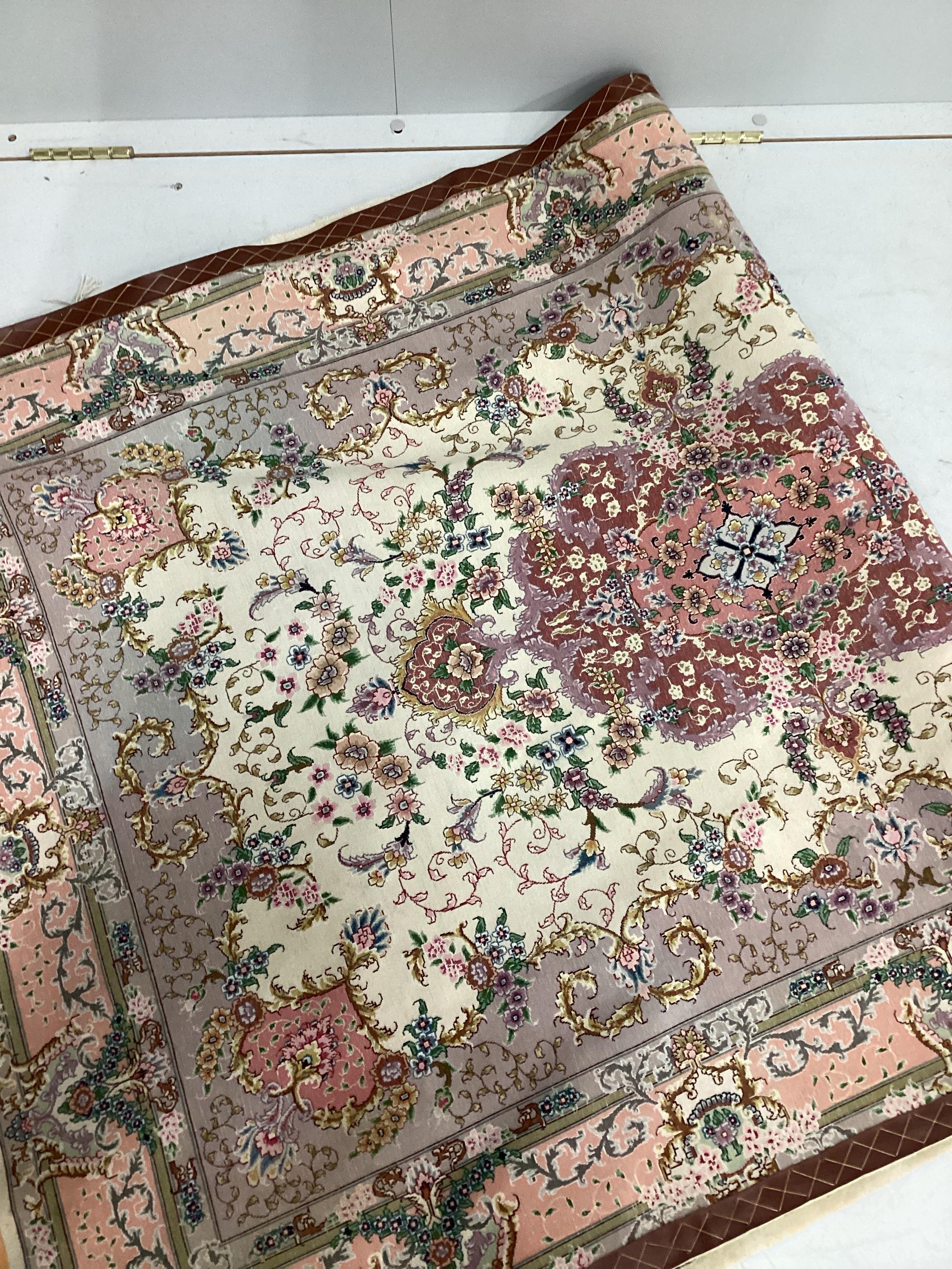 A North West Persian ivory ground part silk rug, 160 x 100cm